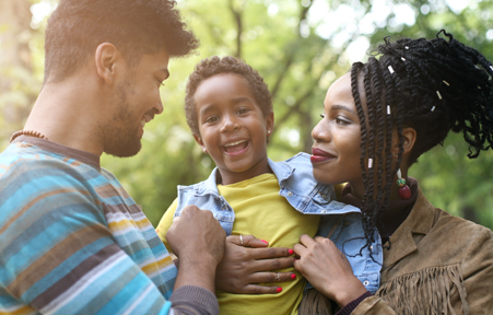 Family of three smiling